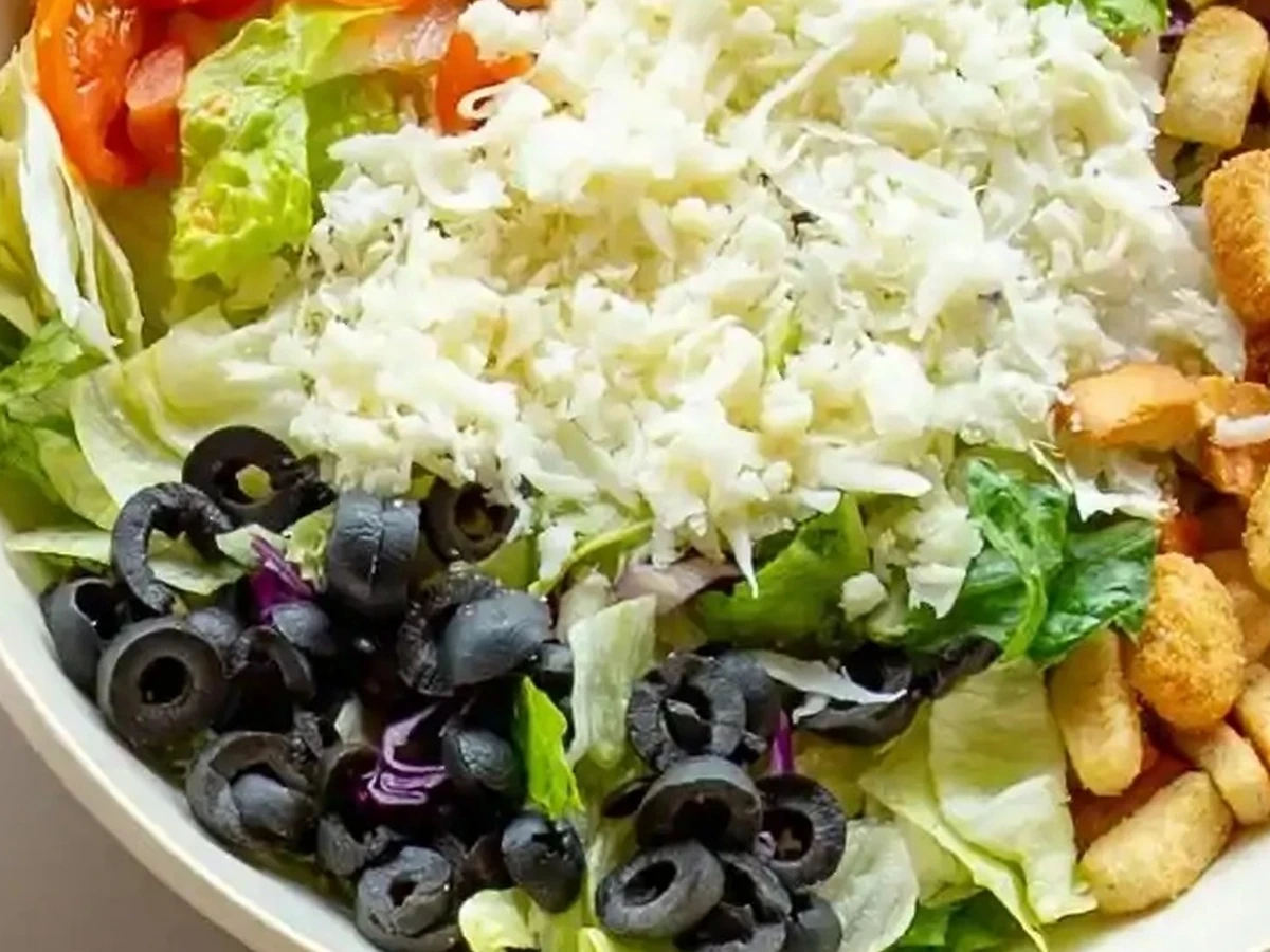 Fresh garden salad with olives, feta and croutons at Basile's 2 For 1 Pizza & Pasta in Beaumont, AB