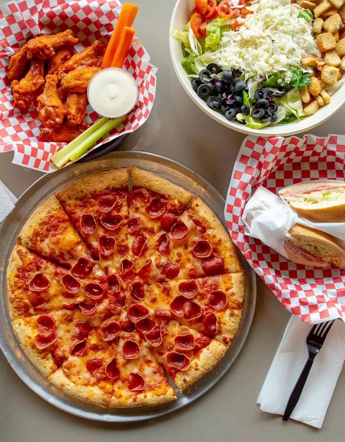 Freshly plated dishes and shareable appetizers at Basile's 2 For 1 Pizza & Pasta in Beaumont, AB