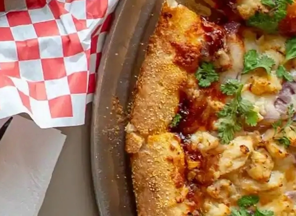 Build-your-own pizza with fresh toppings at Basile's 2 For 1 Pizza & Pasta Beaumont AB