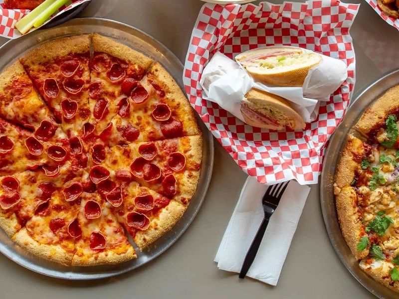 2 For 1 Specialty Pizza at Basile's 2 For 1 Pizza & Pasta in Beaumont, AB